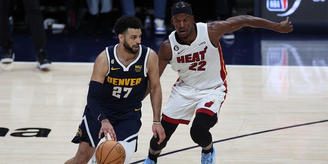 Jamal Murray dribbles the ball