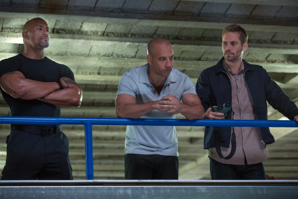 Dwayne Johnson, Vin Diesel, and Paul Walker, are spotted together during a scene from Fast & Furious 6.  