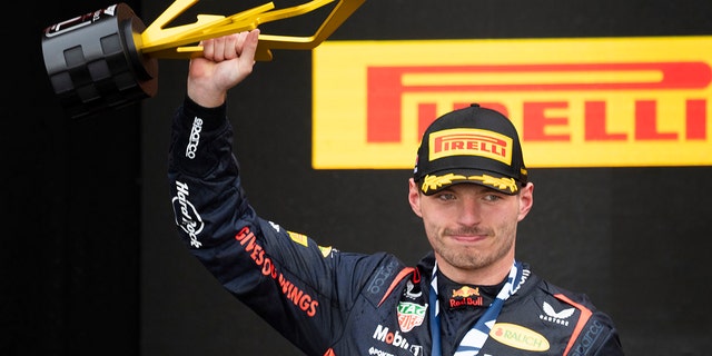 Max Verstappen holds the trophy