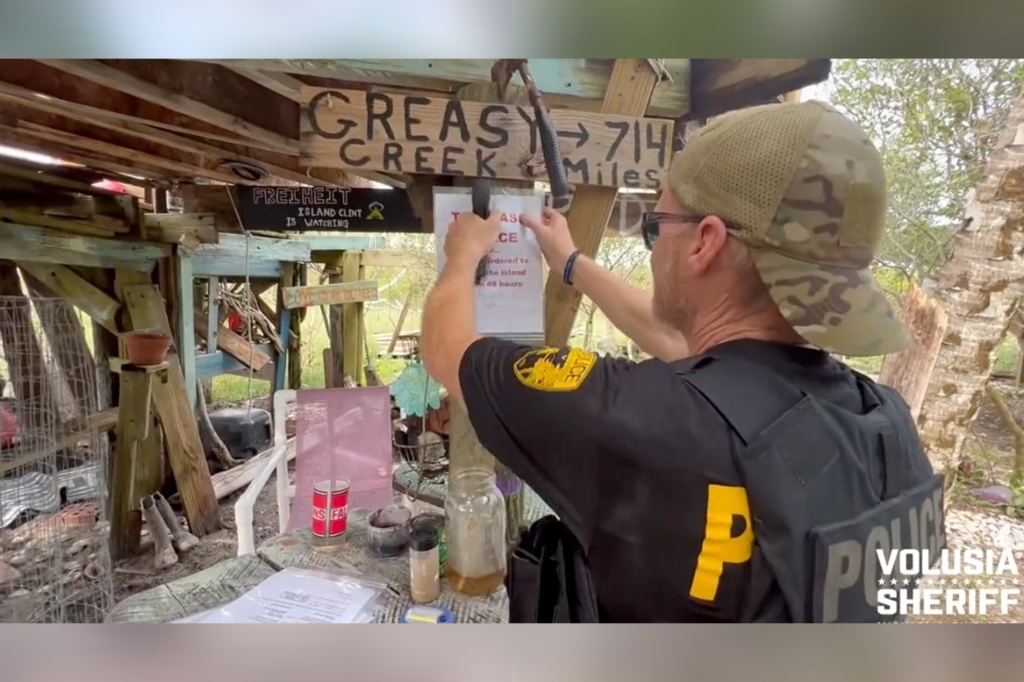 Officer 's strategically placed eviction signs around the camp to ensure whoever was building up the abandon island would get the message.