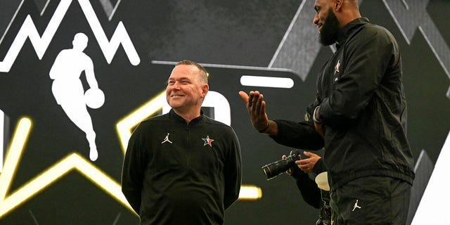 Michael Malone of the Denver Nuggets with LeBron James at the NBA All-Star game