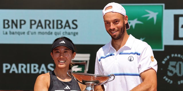 Miyu Kato and Tim Puetz pose with trophy