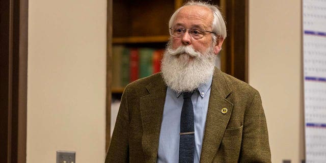 Prosecutor Bill Thompson walks through the courtroom