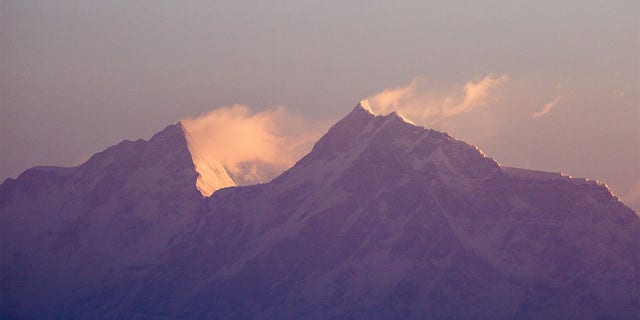 Snow blows off of Mount Manaslu