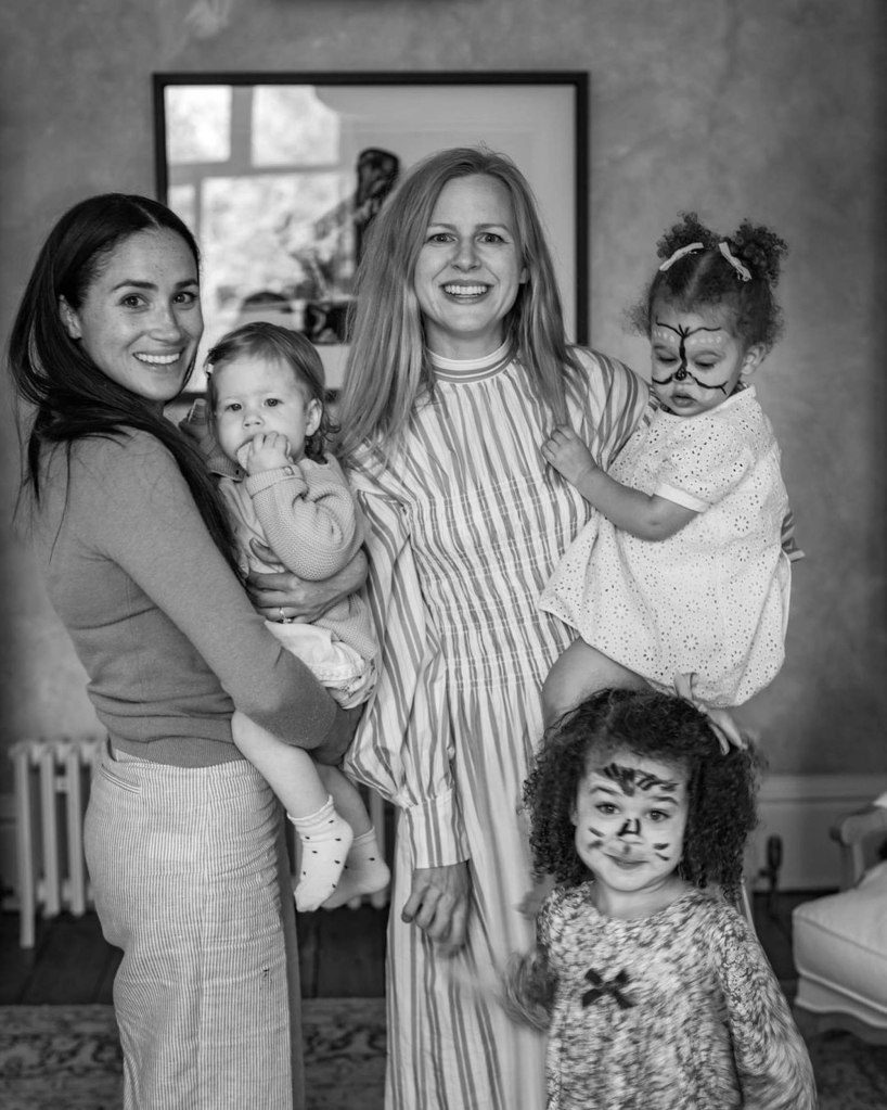 Markle is seen with Princess Lili during her first birthday celebration in London last year. Markle's pal  Camilla Holmstroemis also pictured along with her two young daughters. 