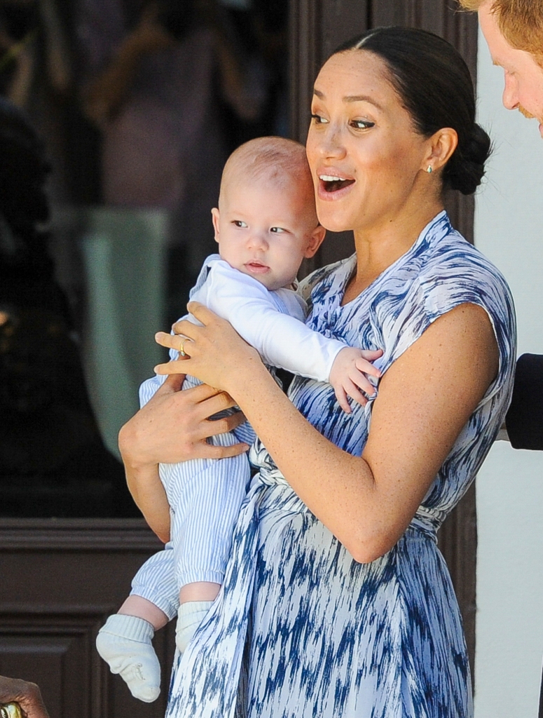 Meghan Markle holds her baby