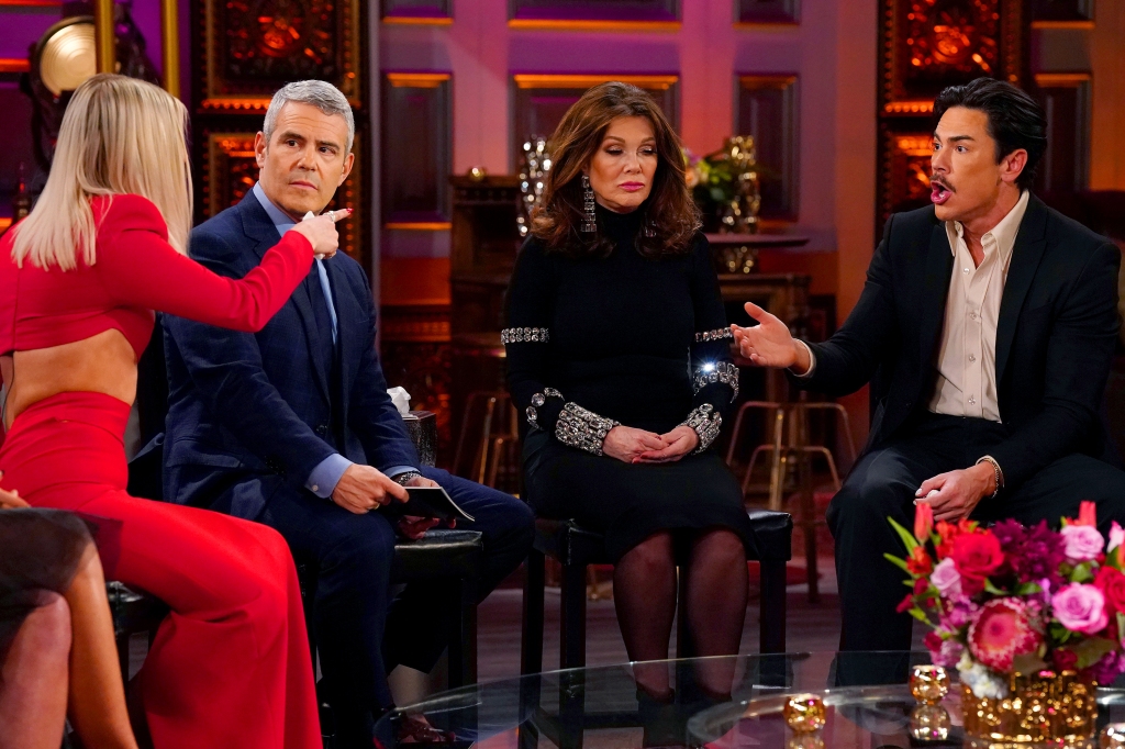 Andy Cohen, Lisa Vanderpump, Tom Sandoval sitting on stools. 