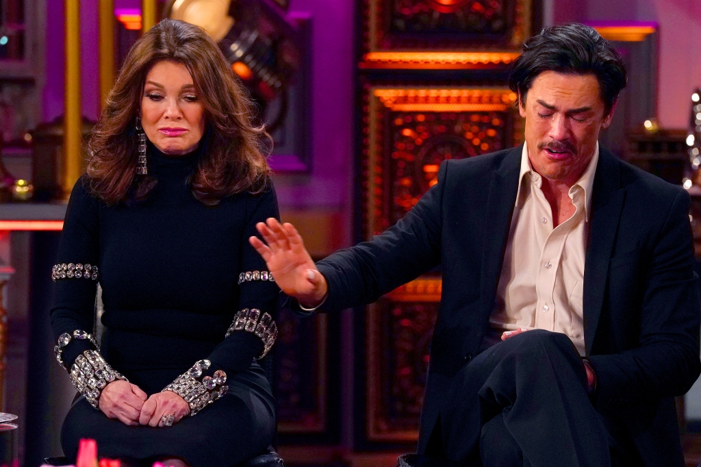 Lisa Vanderpump and Tom Sandoval sitting next to each other on stools. 