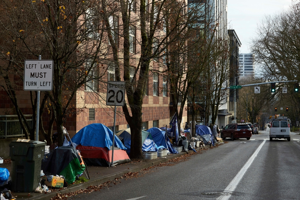 Tents line the sidewalk on SW Clay St in Portland, Ore., on Dec. 9, 2020. 