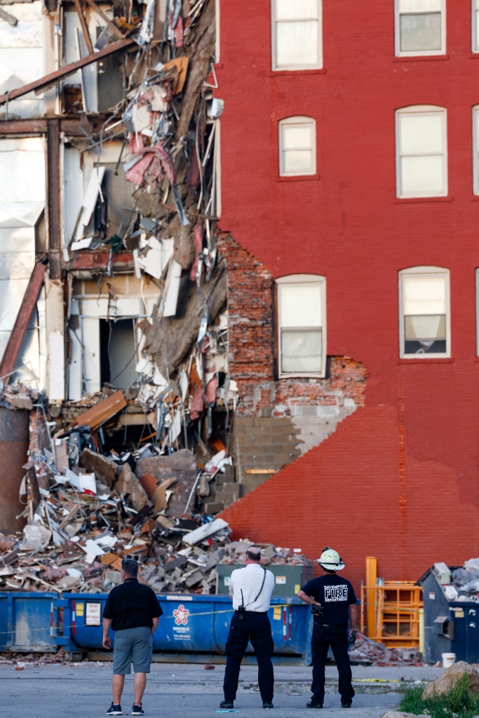 Emergency crews work the scene of a partial building collapse on the 300 block of Main Street, Sunday, May 28, 2023, in Davenport, Iowa. 