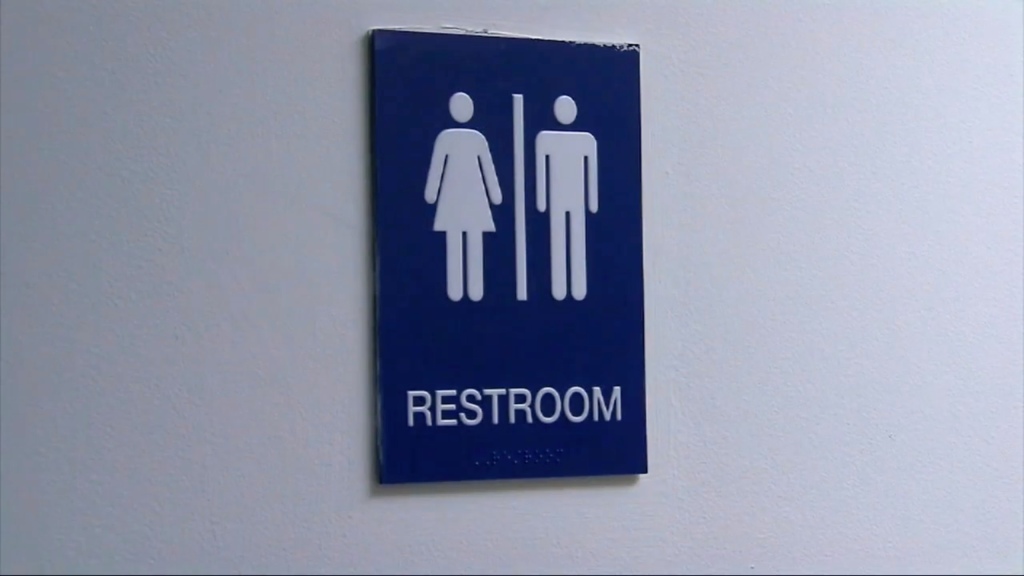 A restroom gender sign.