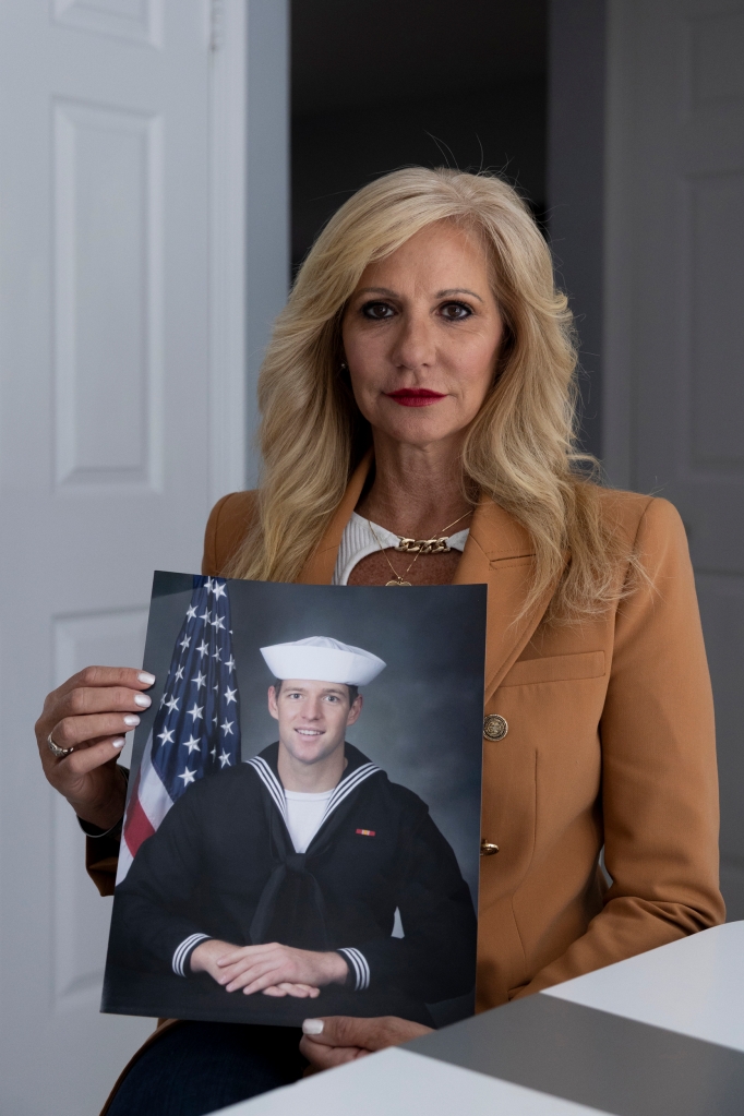 Regina Mullen holds a photo of her youngest son Kyle Mullen.