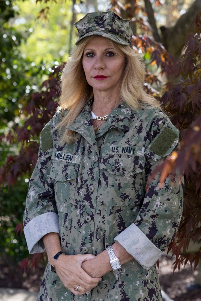 Regina Mullen wears her son Kyle MullenÃs fatigues.