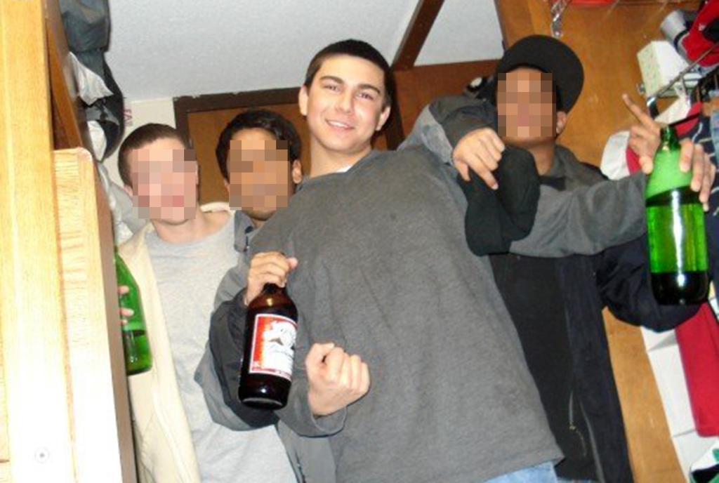 Teenage Nilo posing with alcohol.