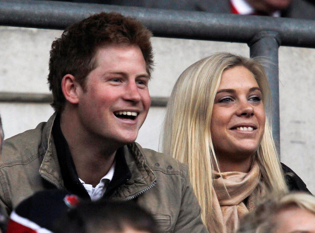Prince Harry (L) and Chelsy Davy attend the friendly international rugby union match between England and Australia at Twickenham in London on Nov. 7, 2009.  