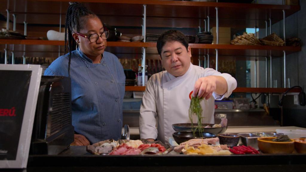 Chef Alisa Reynolds and Chef Mitsuharu Micha Tsumura cooking together. 