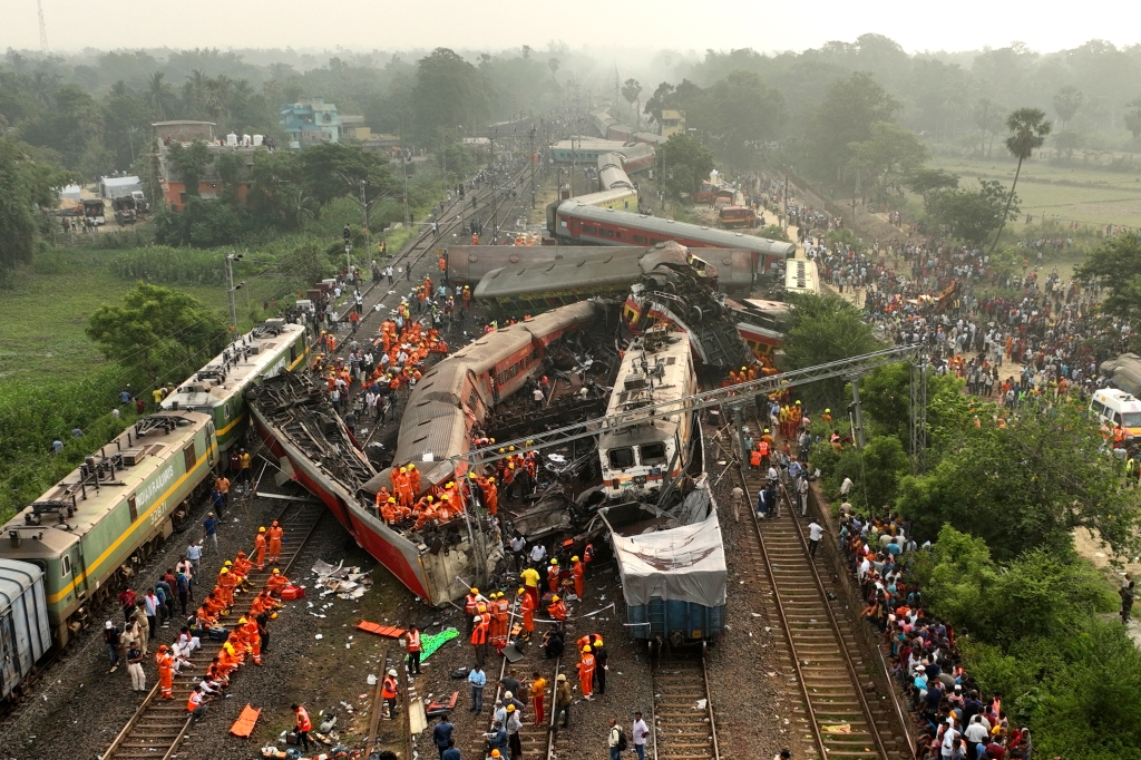 Rescuers desperately combed through the wreckage and climbed atop the wrecked trains, searching for passengers. 

