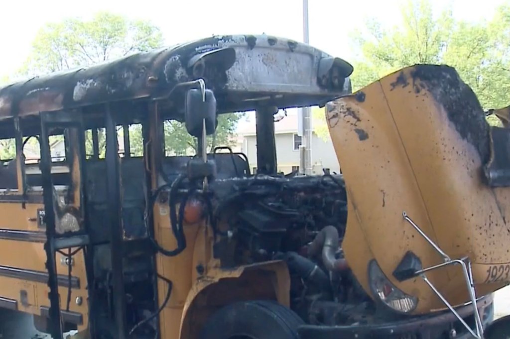 Charred yellow school bus after the fire