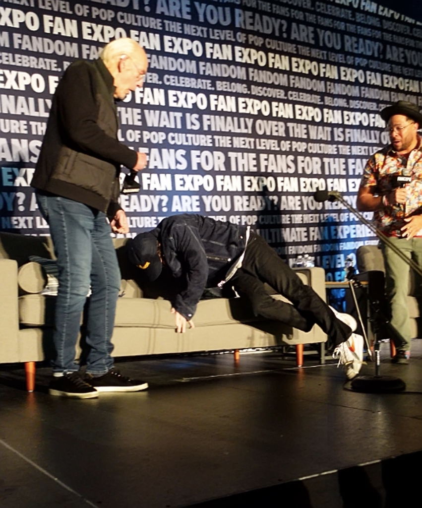 Michael J. Fox takes a tumble and falls on to the couch on stage during "Back to the Future" Q&A panel with actors Michael J. Fox, Christopher Lloyd and Tom Wilson at Fan Expo in Philadelphia, Pennsylvania, USA.
