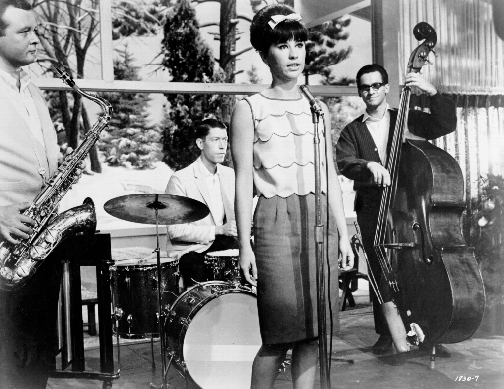 Stan Getz (left) and Astrud Gilberto are the Go Go set in a scene from the film 'Get Yourself A College Girl', 1964. 