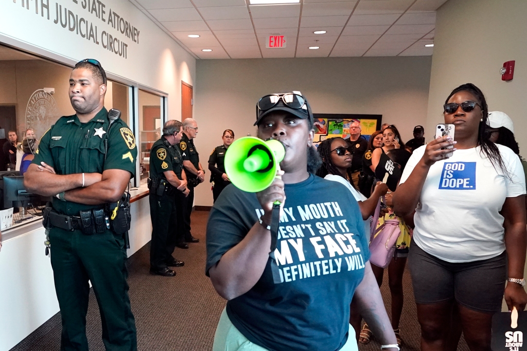 Protesters gather in outside the state attorney's office at the Marion County Courthouse,