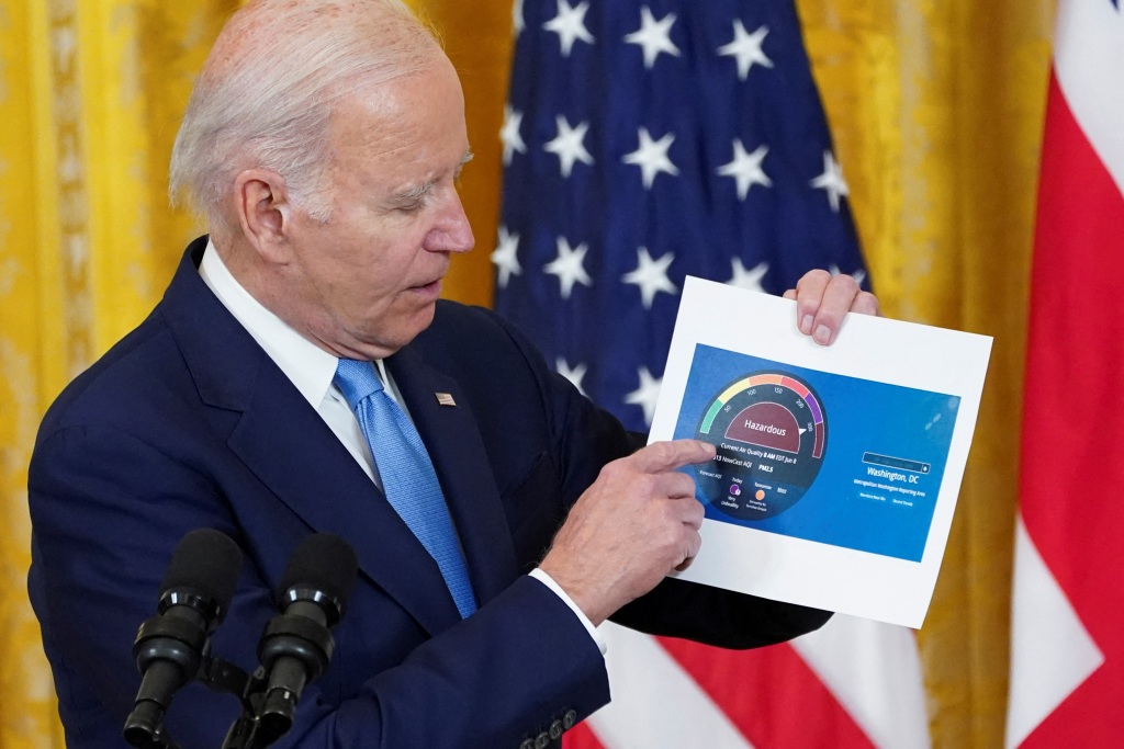 President Biden showing off an air quality chart for the Washington, DC at a White House event on June 8, 2023.