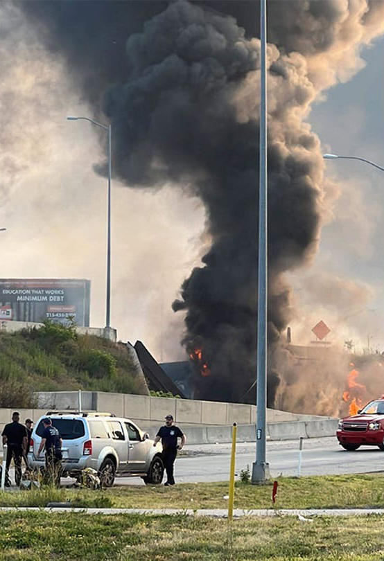 The flames broke out at around 6:30 a.m. on Sunday underneath the overpass.  