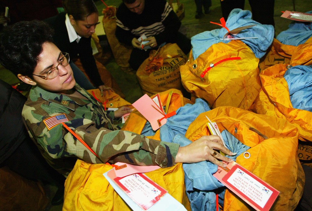 Major Tanya Bradsher, a member of U.S. Army, checks personal mail to be delivered to South Korean troops in Iraq, at the United States Forces Korea Military Mail Terminal (MMT) at Kimpo airport, January 27, 2005 in Seoul, South Korea.