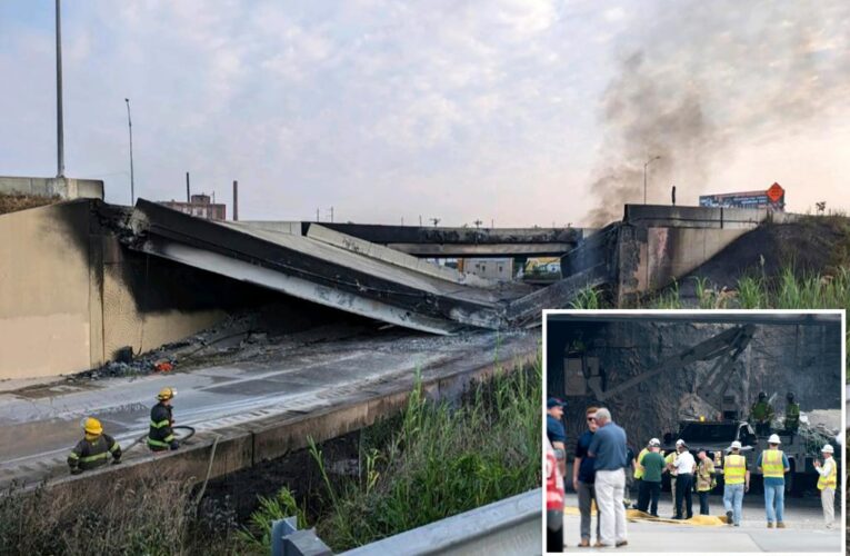 Vehicle trapped under rubble as officials warn it will take ‘months’ to fix overpass