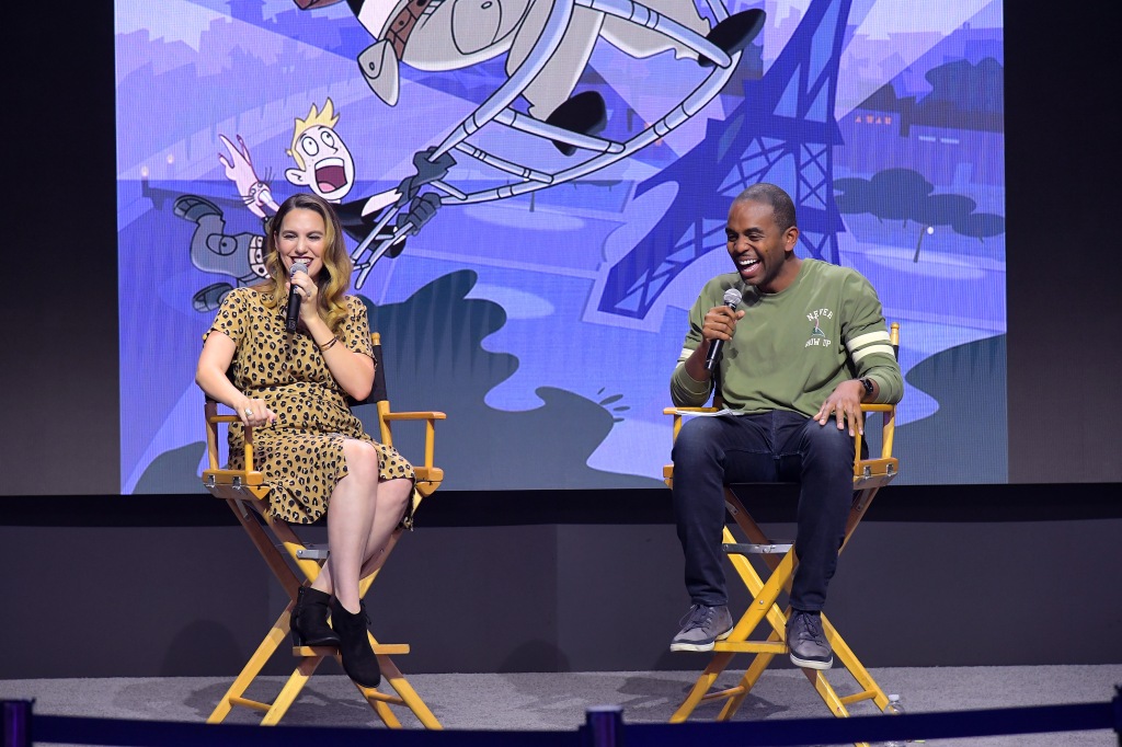 Christy Carlson Romano of "Kim Possible" and "Even Stevens" and Albert Lawrence speak at the Disney+ Pavilion at Disney