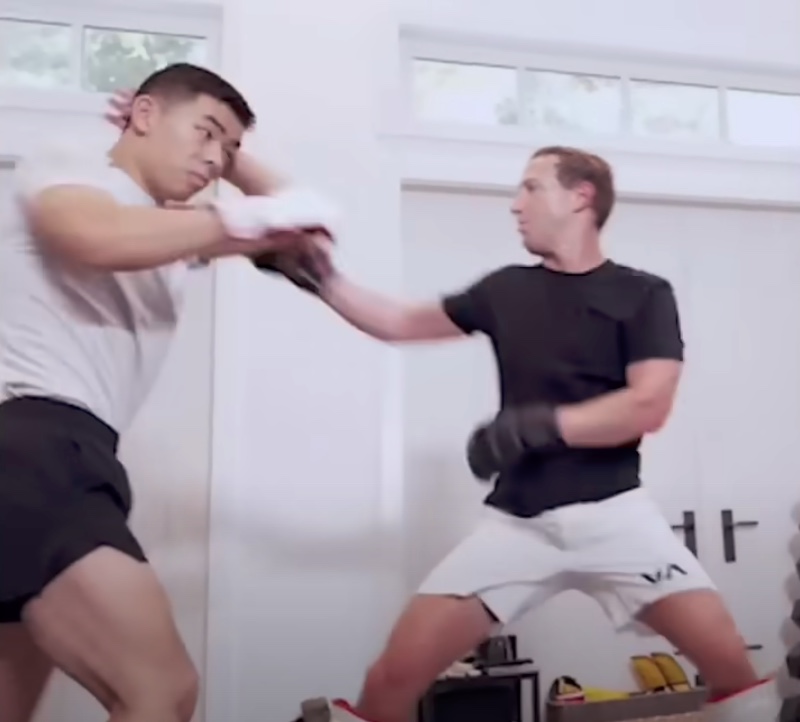 Mark Zuckerberg, right, training kickboxing.