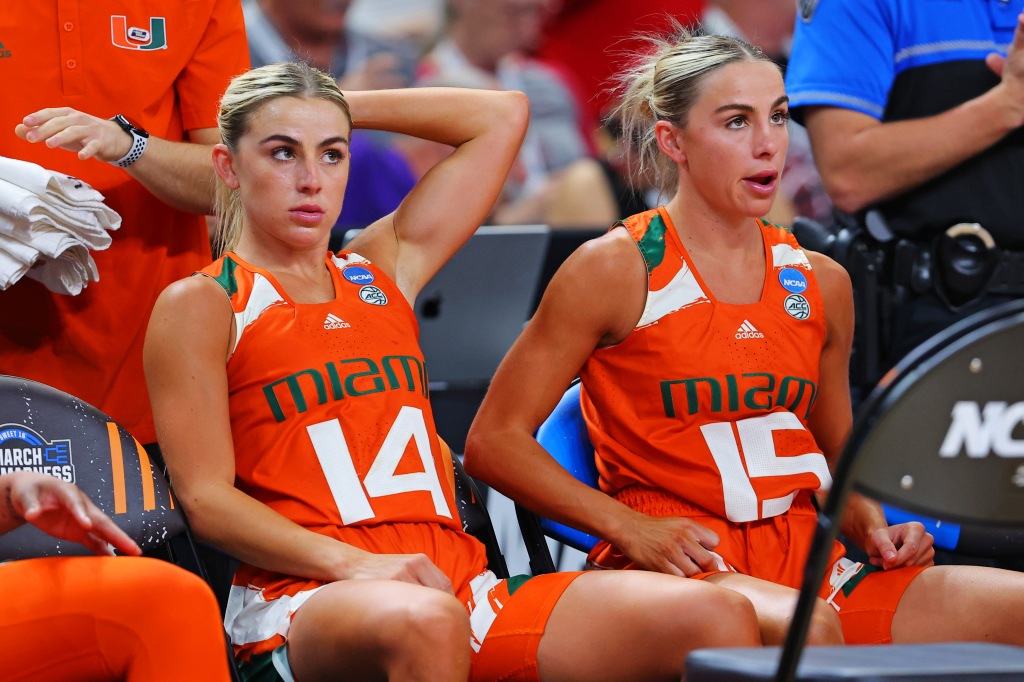 Haley and Hanna Cavinder in Miami uniforms. 