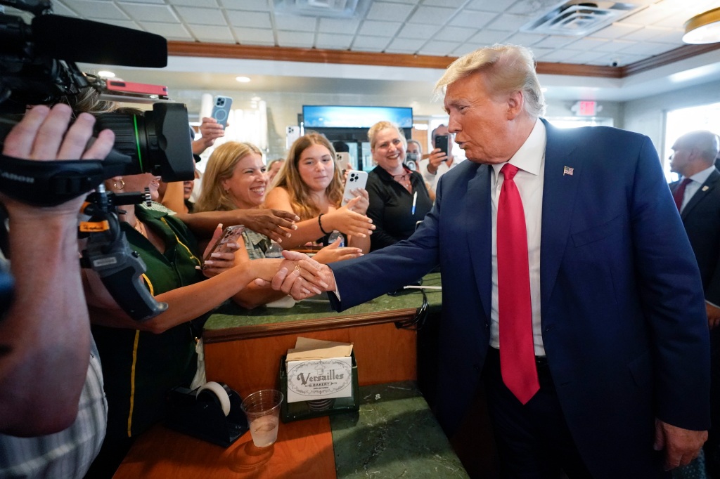 Trump meets supporters following his arraignment. 