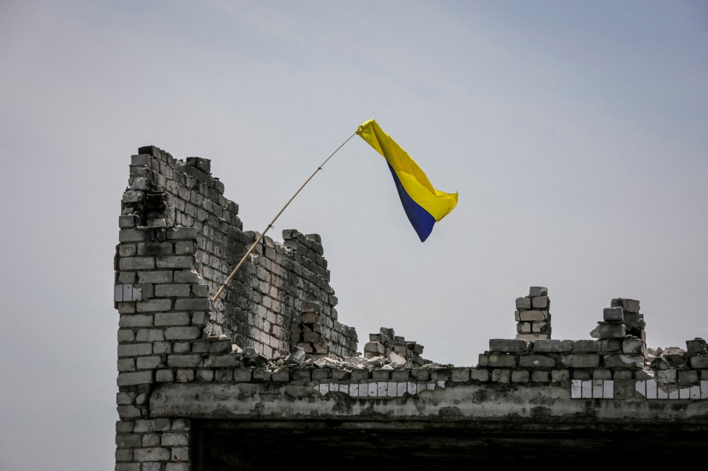 A Ukrainian national flag is seen,  near the front line in the newly liberated village Neskuchne in Donetsk region.