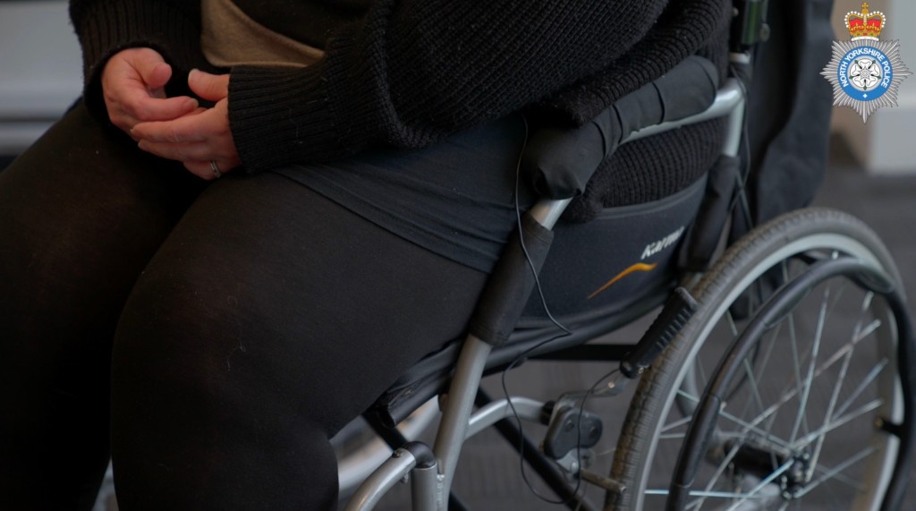 Victim's lower half seen in a wheelchair