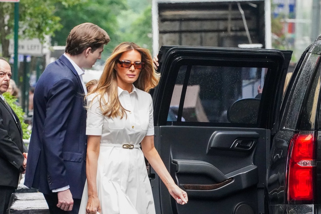 Barron and Melania head to their car.