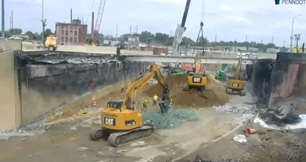 Crews can be seen clearing the debris and preparing for the construction phase to begin.  