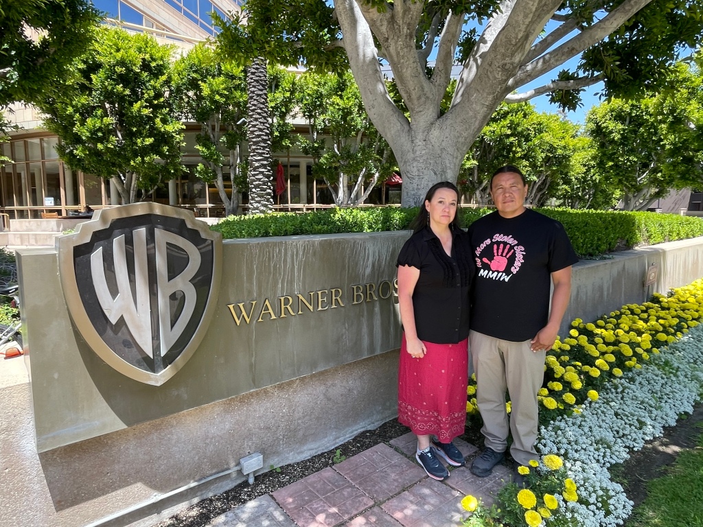 Sara Jumping Eagle and Chase Iron Eyes in front of Warner Bros. headquarters