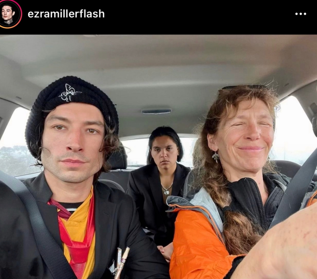 Ezra Miller and Tokata Iron Eyes, aka Gibson, in a car being driven by an unknown woman