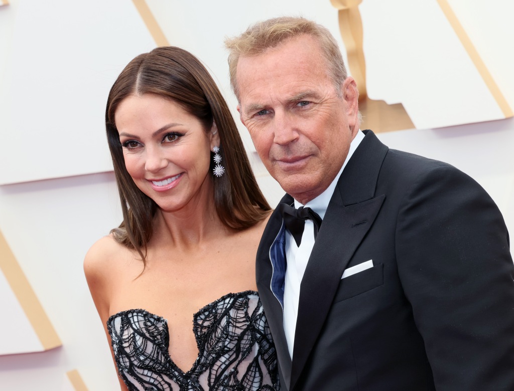 Christine Baumgartner and Kevin Costner attend the 94th Annual Academy Awards at Hollywood and Highland in 2022.
