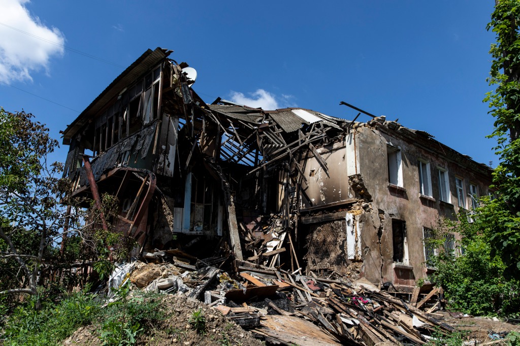 View of a destroyed residential building hit by a Russian artillery strike in Kherson. 