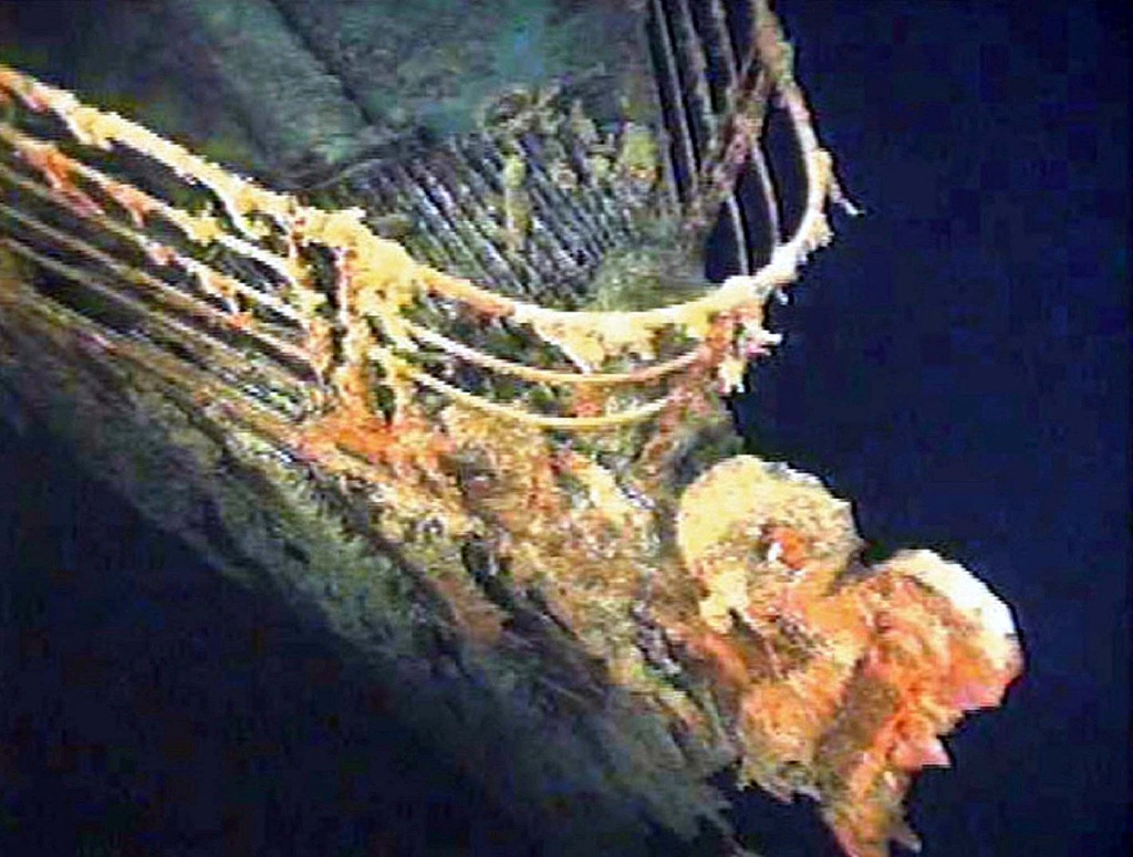 The port bow railing of the Titanic lies 12,600 feet below water, and about 400 miles east of Nova Scotia. 