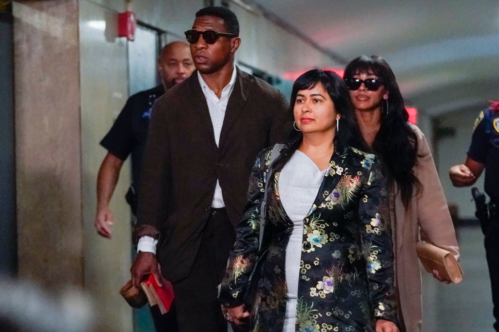 Majors and Priya Chaudry walk through the courtroom halls. 