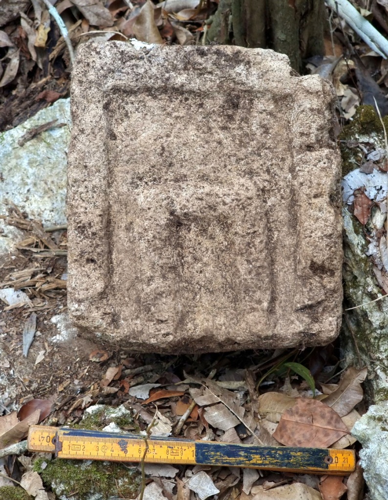 A view shows a part of a stone facade.