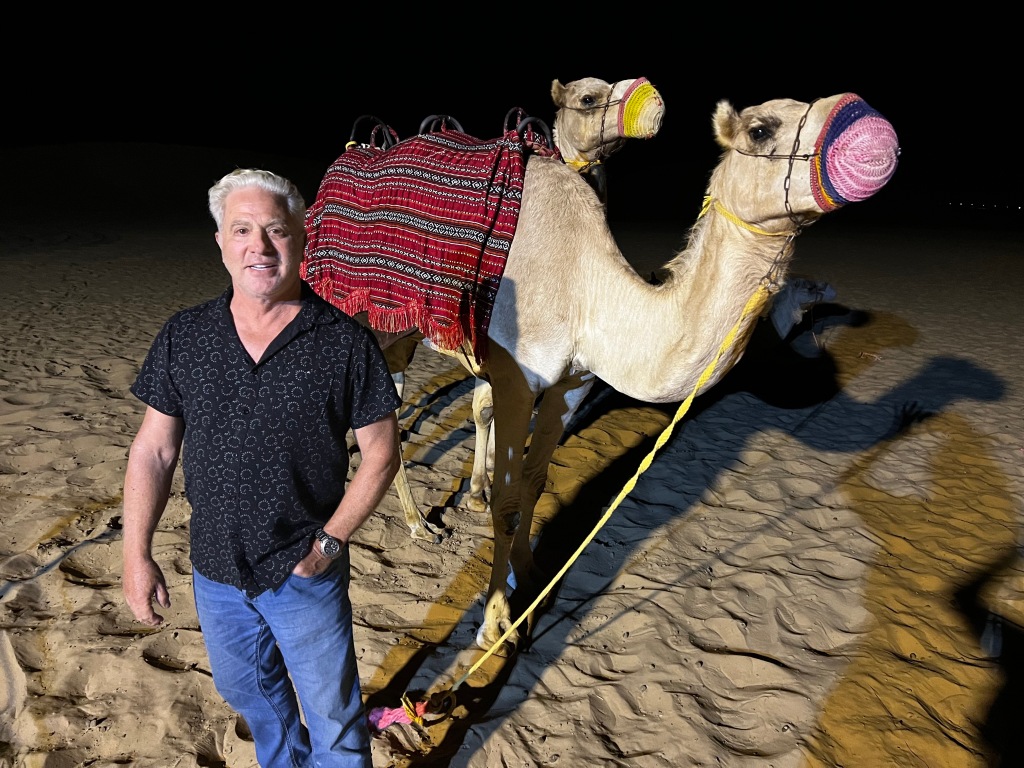 Bill Price with camel in Abu Dhabi. 
