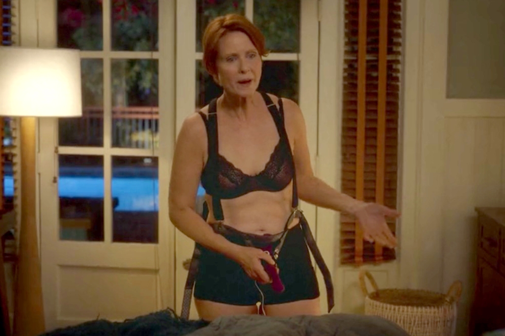 Miranda (Cynthia Nixon) puts on a strap-on, in underwear and a harness. 