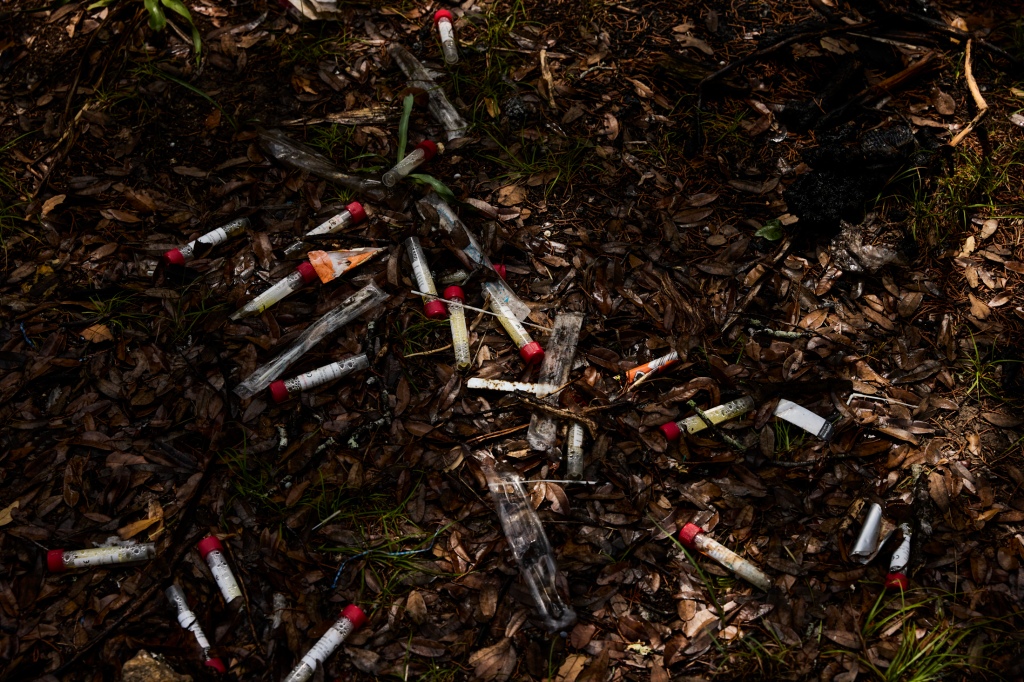 Discarded medical waste litters a trail in the Mary Moore Searight Metropolitan Park in Austin, Texas on June 22, 2023.