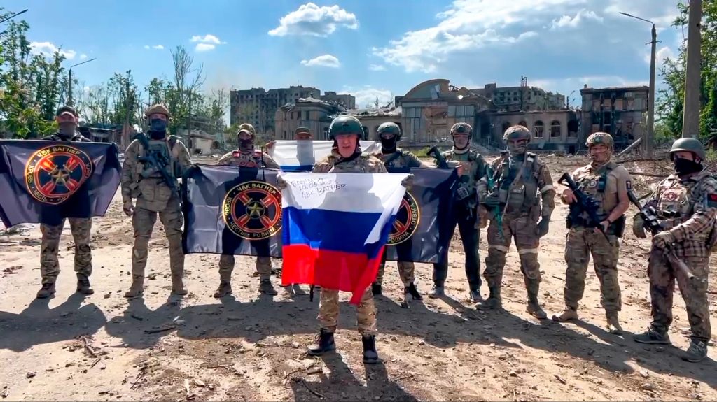Yevgeny Prigozhin, the head of the Wagner Group military company speaks holding a Russian national flag in front of his soldiers in Bakhmut, Ukraine. 