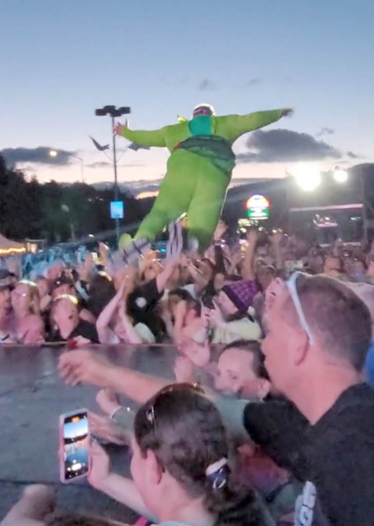 The unidentified Ninja Turtle cosplayer flies into the audience.