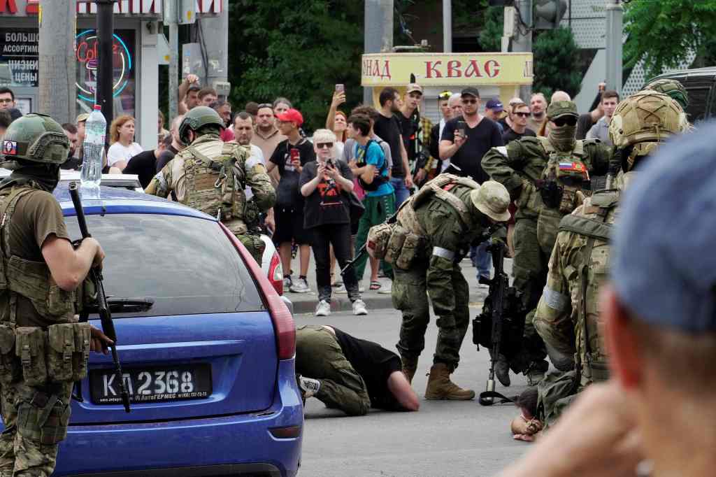 Members of Wagner group detain a man in Rostov-on-Don, Russia on June 24, 2023. 